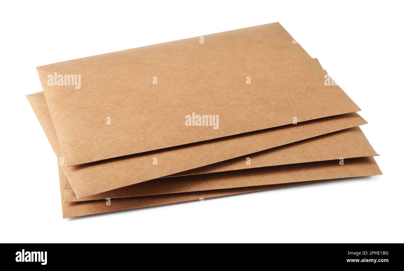 Stack of brown letters on white background Stock Photo