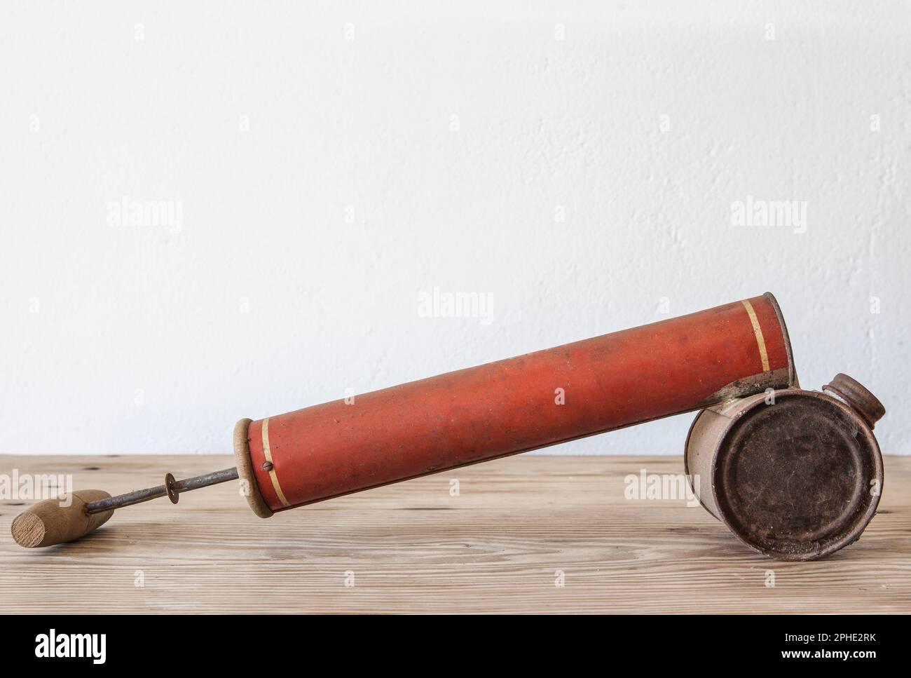 Old rusty manual spray pump for insecticides. Country style background Stock Photo