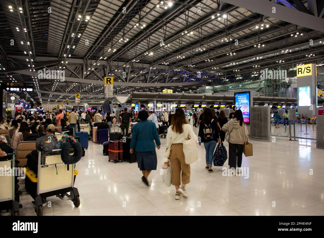 Thai people and foreign travelers passengers walking carry luggage