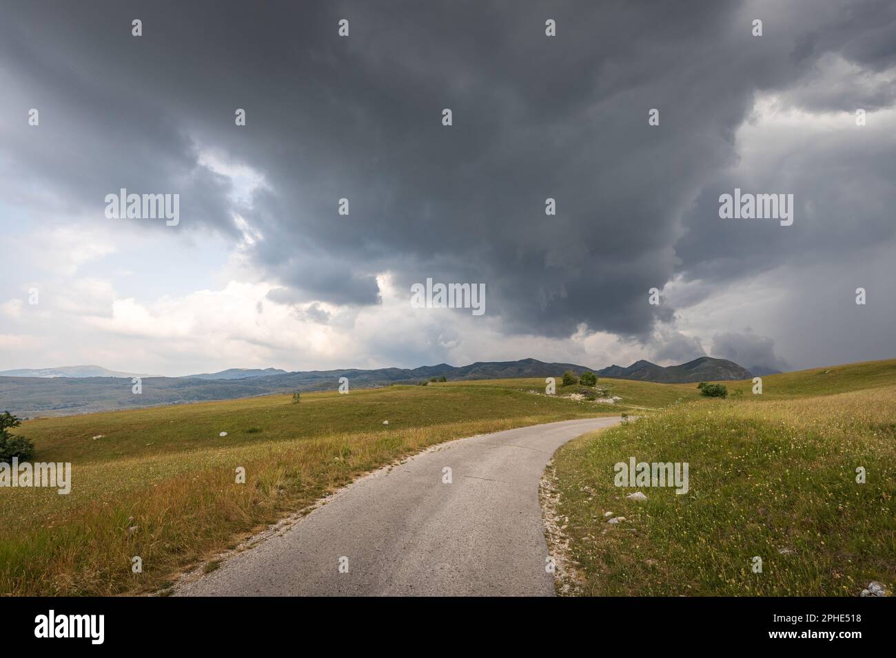 Road trip to the highland with stormy clouds in the sky Stock Photo - Alamy