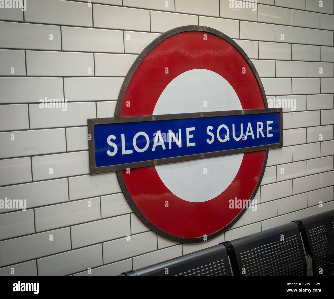 The iconic London Underground station name design for Sloane Square tube station in southwest London. The London Underground roundel, was designed by Stock Photo