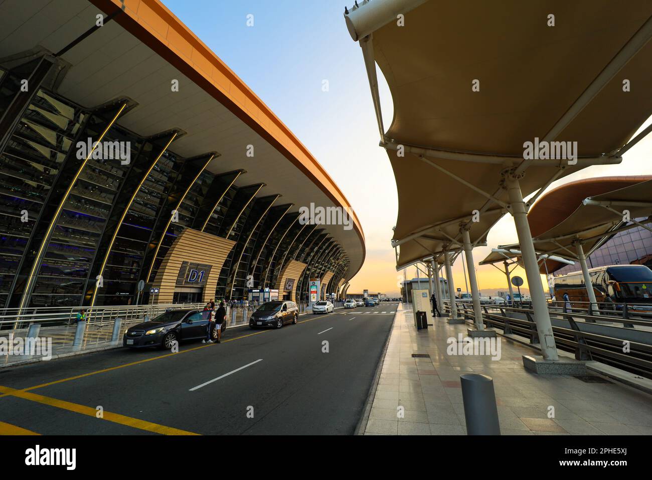 Jeddah , Saudi Arabia - Mar 11 2023 : Passengers traveling through King Abdulaziz International Airport - flight  and booking concept Stock Photo