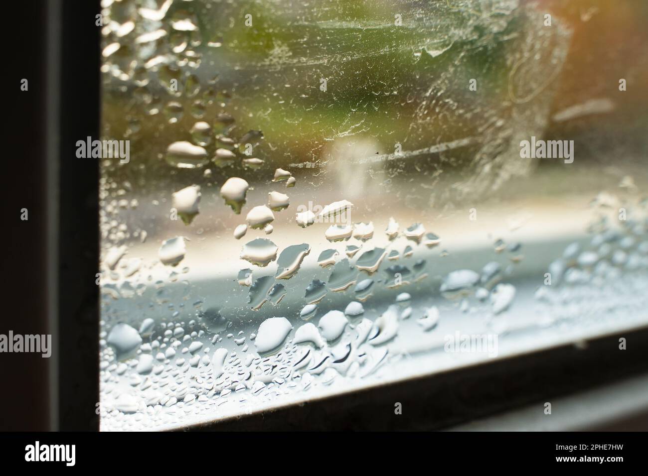 Drops of condensation on the window close-up. Humidity and temperature difference between the street and the room Stock Photo