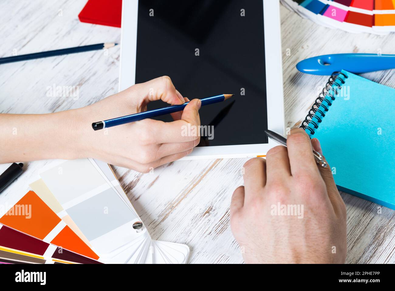 Web designer choosing colors from swatches Stock Photo - Alamy