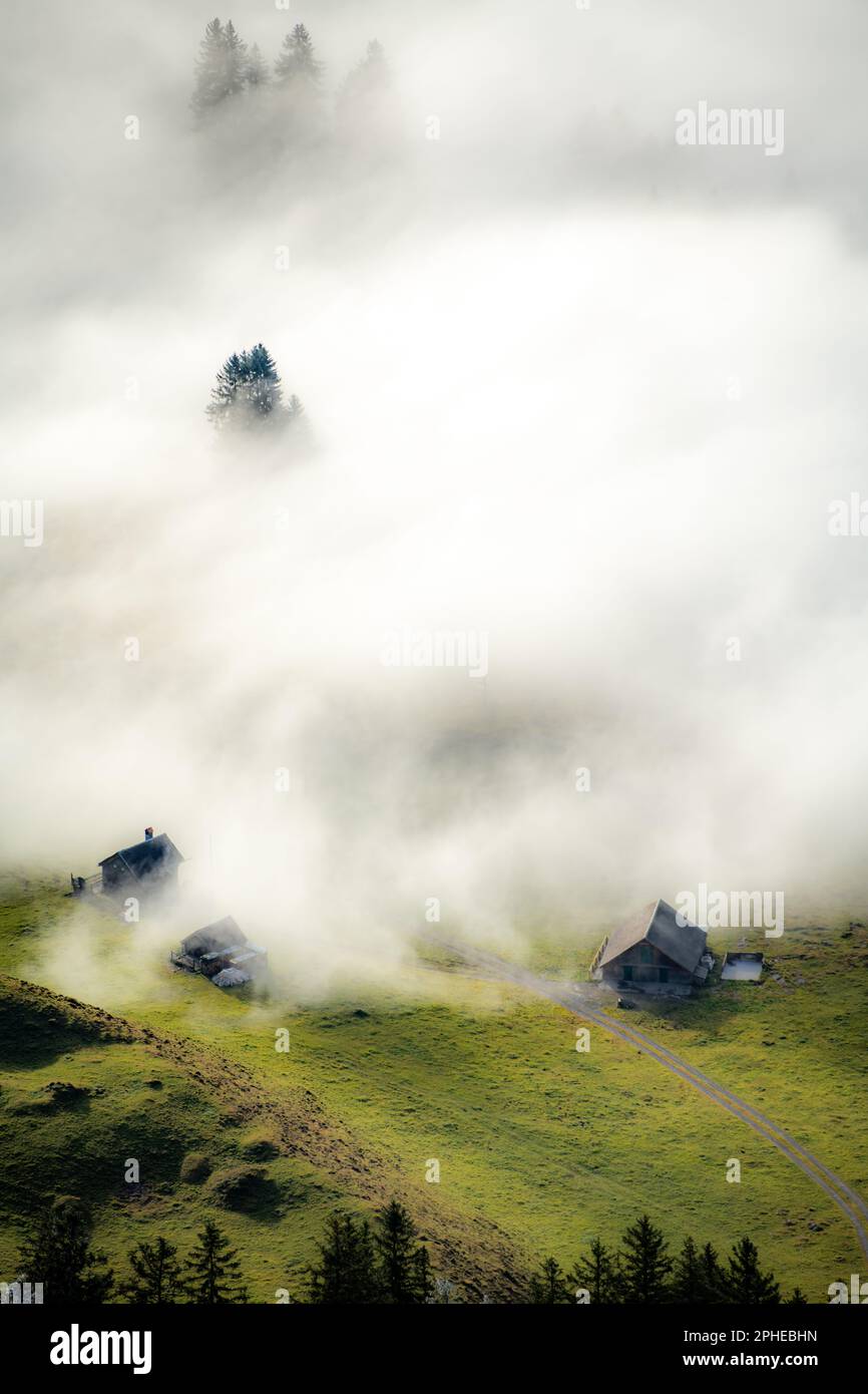 A farm house from above immersed in fog Stock Photo - Alamy