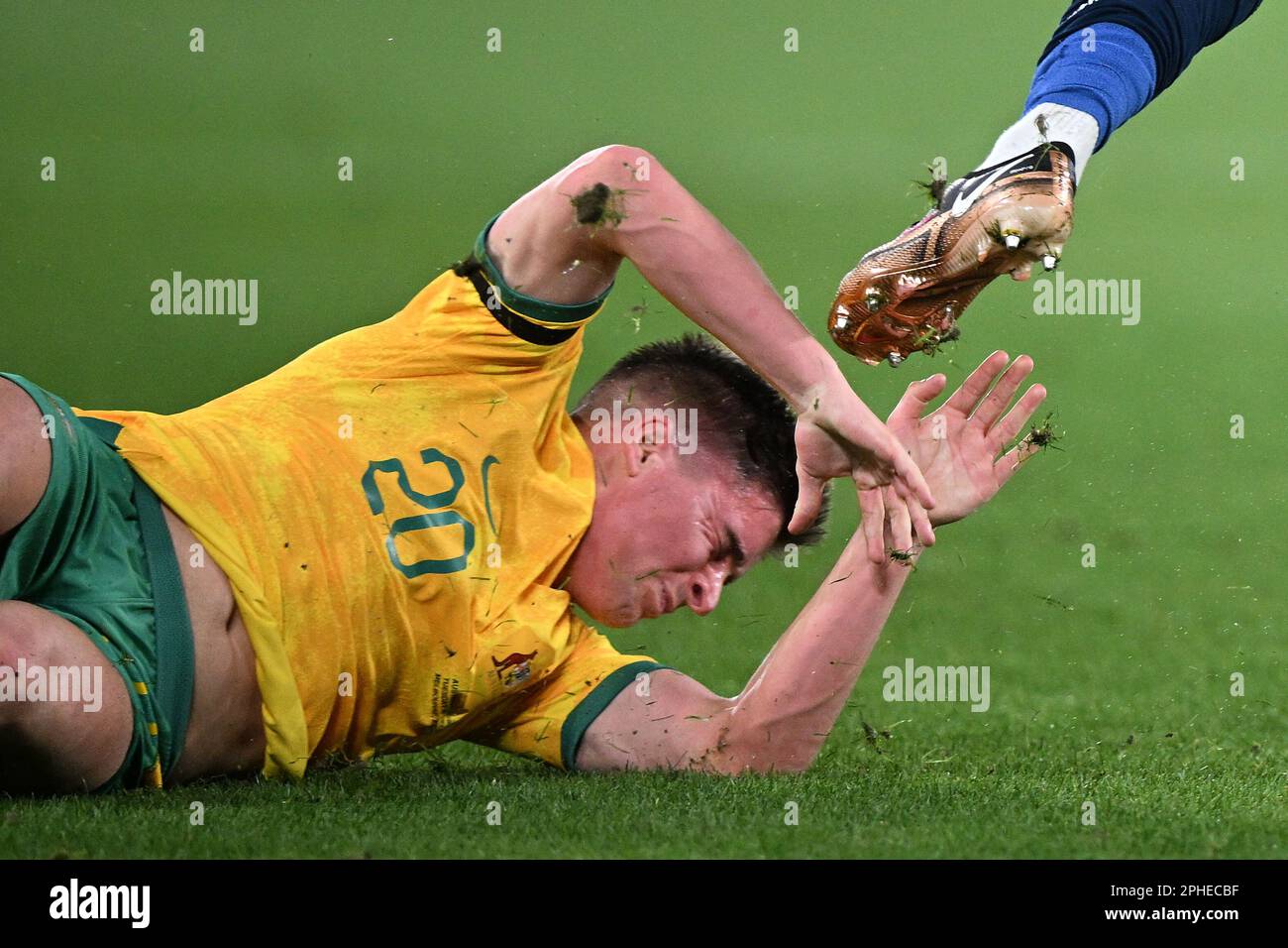 Cameron Devlin of Australia sustains an injury during the soccer match ...