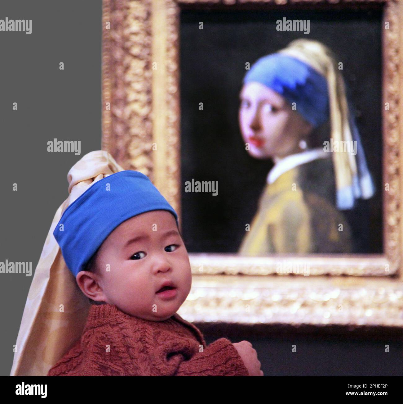 Girl with a Pearl Earring (1665) A ‘tronie by Dutch painter Johannes Vermeer  1632-1675. Vermeer’s most famous painting.Not a portrait,but a ‘tronie'.Rijksmuseum amsterdam Stock Photo