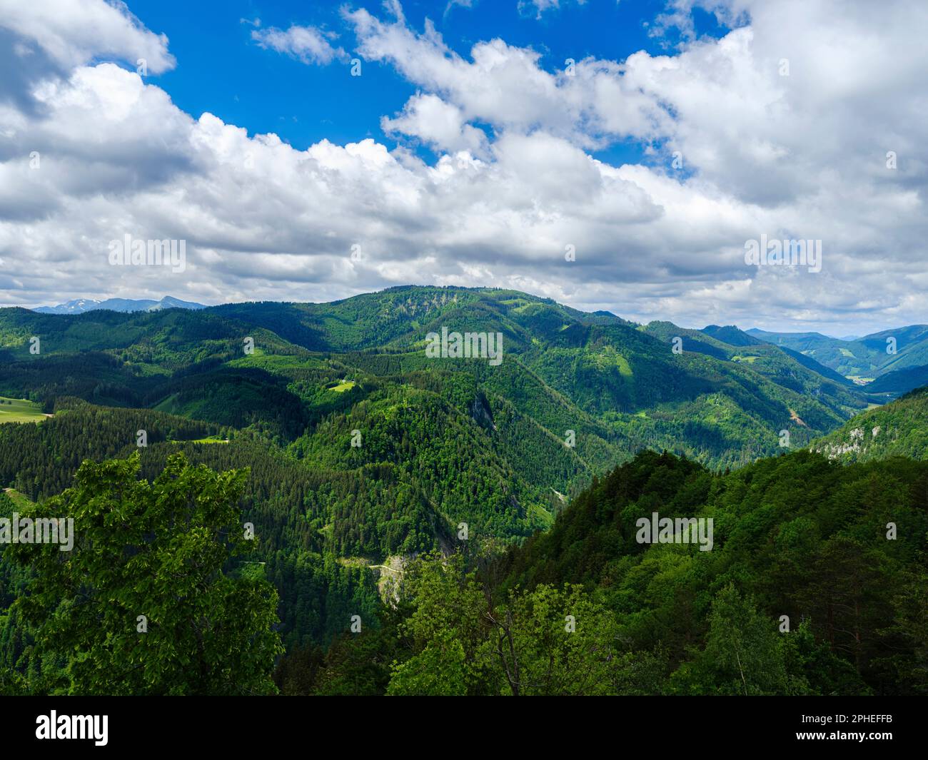 View over the mountain ridge Vordere Tormaeuer towards village of Gaming.  Nature Park Oetscher-Tormaeuer in the Alps of Lower Austria. Europe, Austri Stock Photo