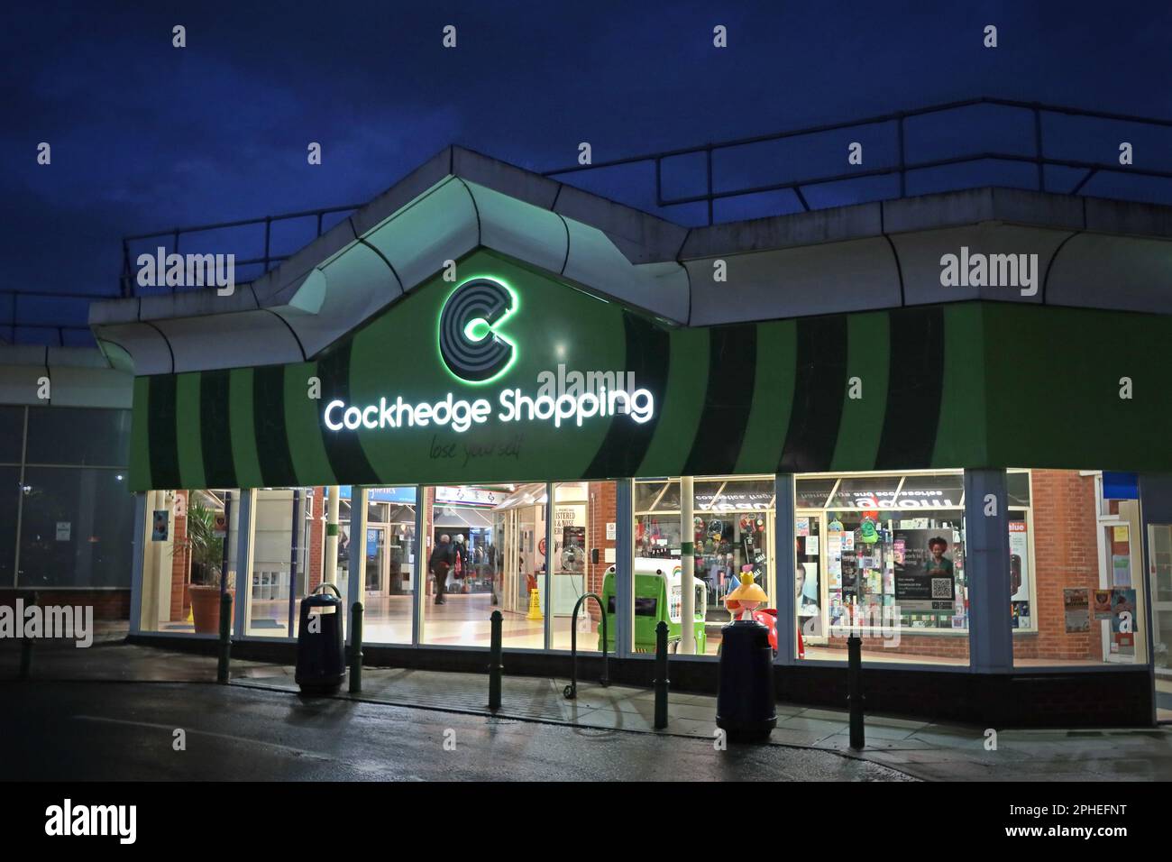 Entrance to the Cockhedge Shopping Centre & Asda superstore, 17 Cockhedge Way, Warrington, Cheshire, England, UK, WA1 2QQ, at dusk Stock Photo