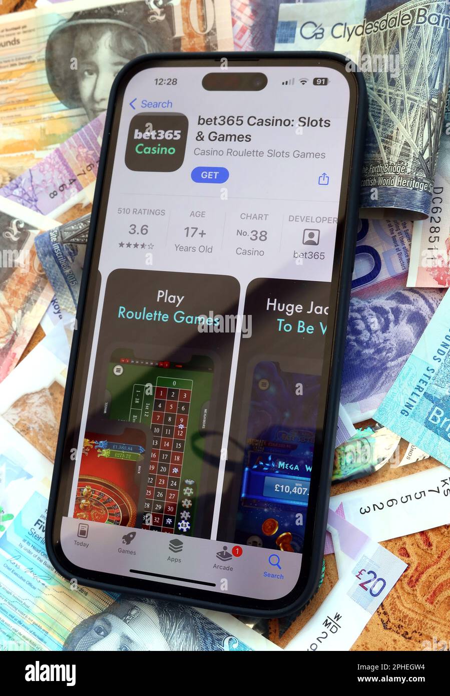 Bet365 Online and smartphone casino, slots and gambling app with Scottish Sterling notes, money easily lost - BeGambleAware Stock Photo