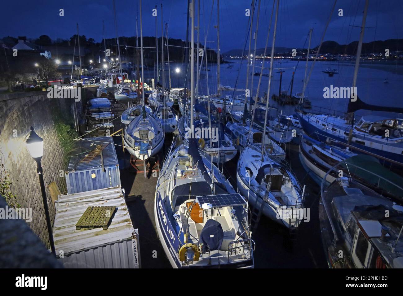 Conwy harbour at dusk, yachts fishing and other boats, walled market town, Conwy County Borough, North Wales, UK, LL28 4NG looking towards Llandudno Stock Photo