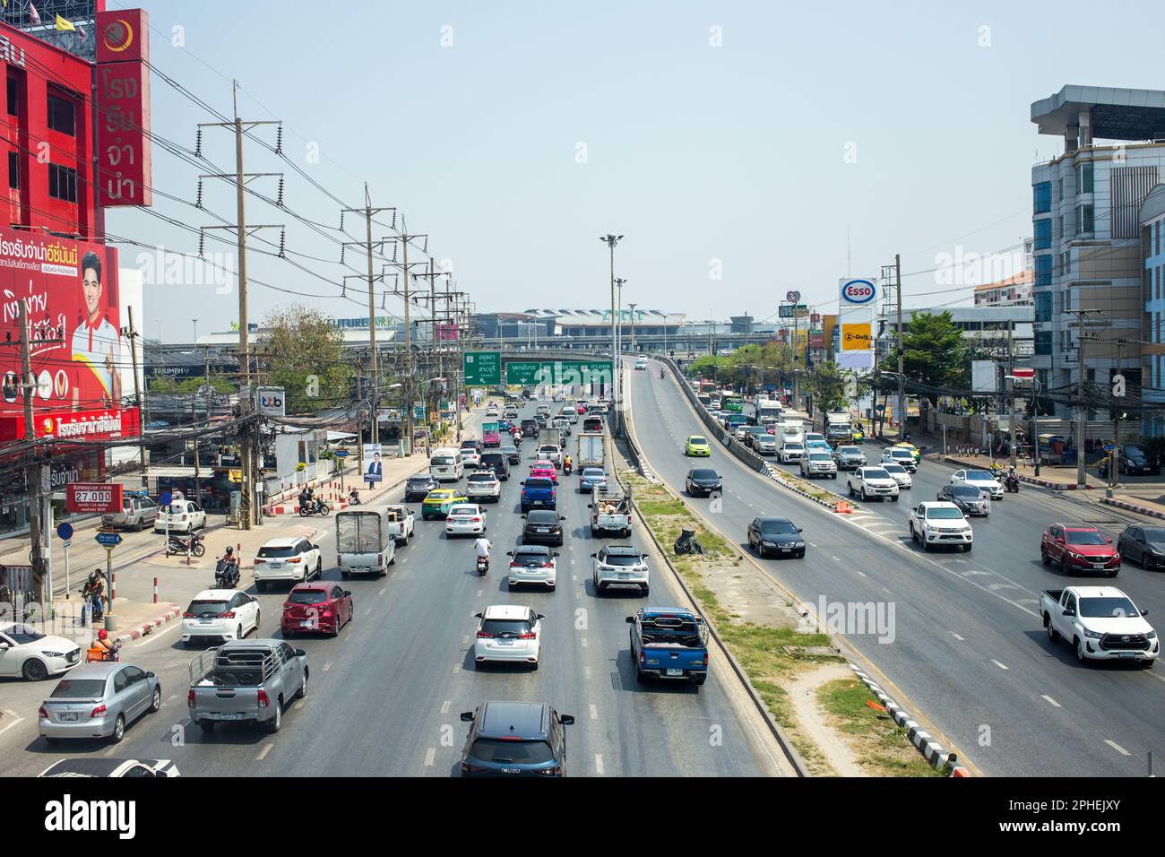 Bangkok, Thailand - February 25 2023: Traffic on Rangsit-Pathum Thani road in Pathum Thani. Stock Photo