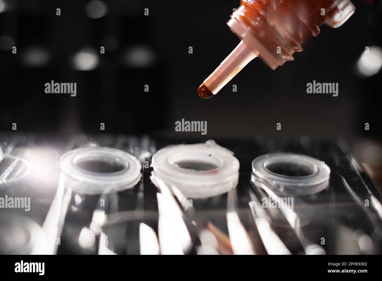 Drop of red inks for permanent tattoo. Professional permanent pigment