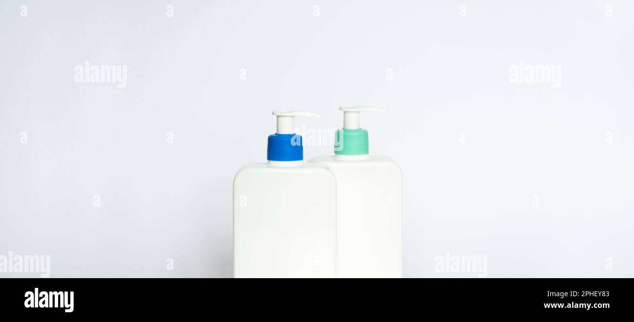 Two white plastic bottles with black dispenser, isolated on white ...