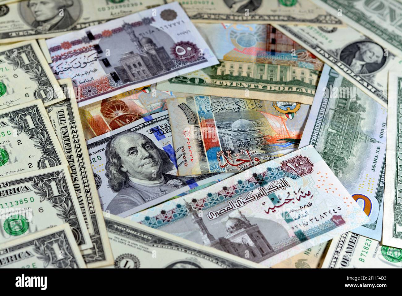 Egyptian pounds currency with American USA dollars cash money banknotes