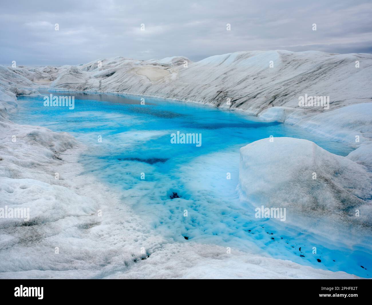 Drainage system with lake on the surface of the ice sheet. The brown ...
