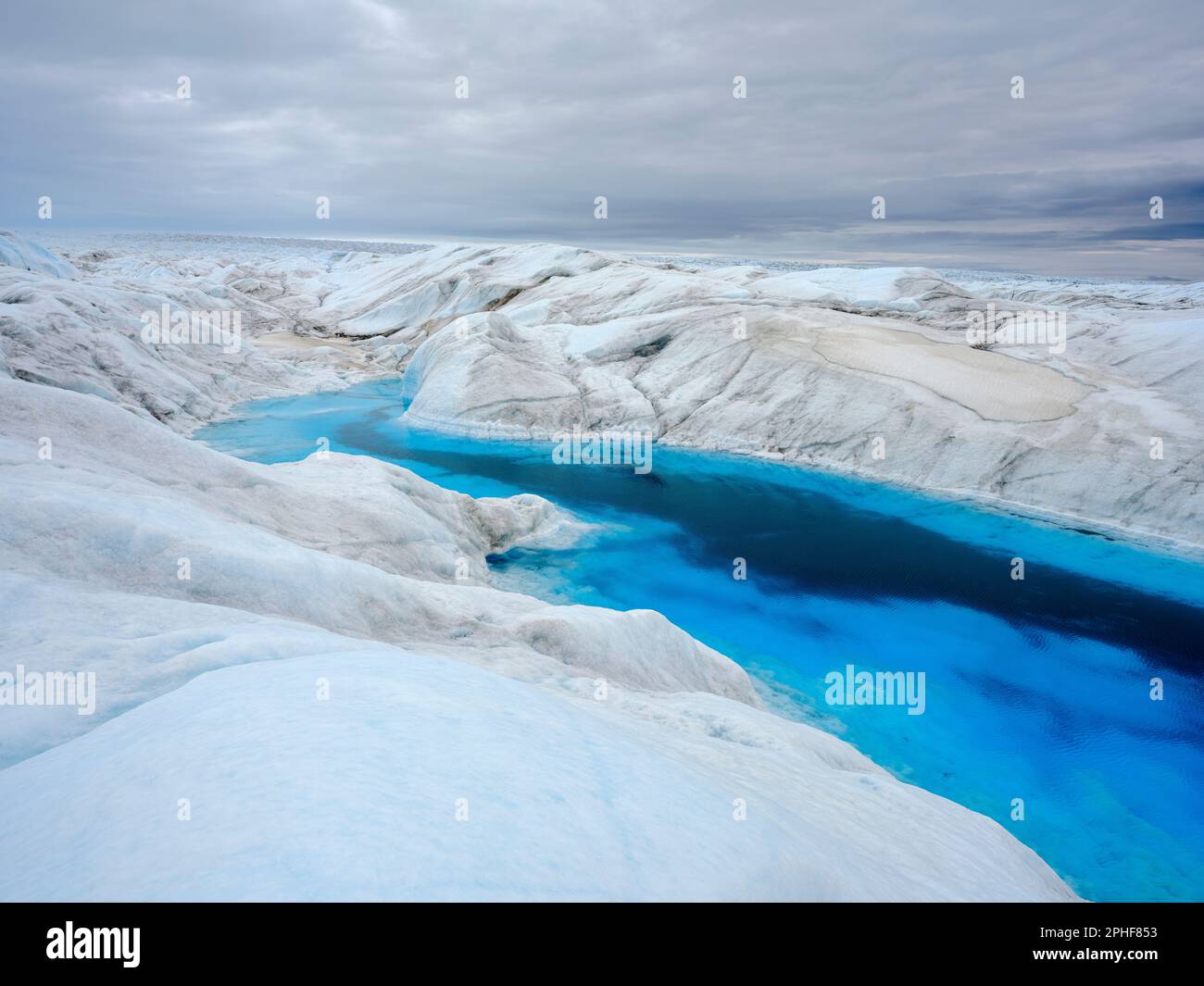 Drainage system with lake on the surface of the ice sheet. The brown ...