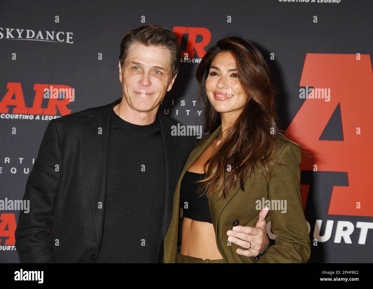 LOS ANGELES, CALIFORNIA - MARCH 27: (L-R) Patrick Whitesell and Pia Miller Whitsell attend Amazon Studios' World Premiere Of 'AIR' at Regency Village Stock Photo