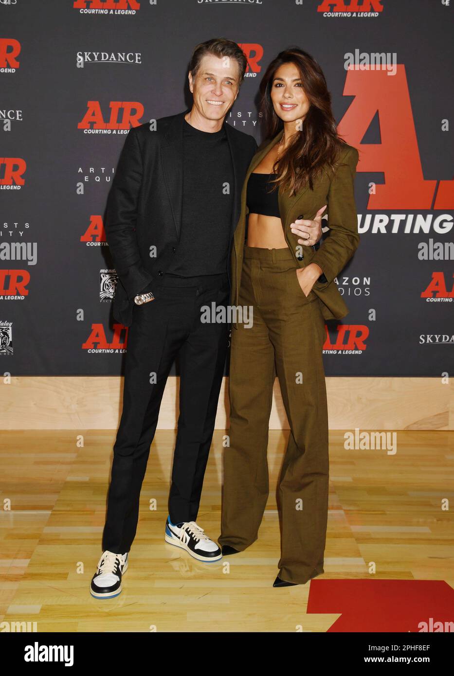 LOS ANGELES, CALIFORNIA - MARCH 27: (L-R) Patrick Whitesell and Pia Miller Whitsell attend Amazon Studios' World Premiere Of 'AIR' at Regency Village Stock Photo