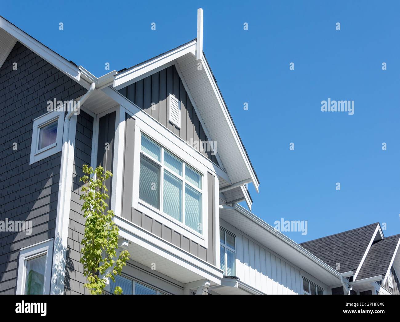 Top of residential townhouse on blue sky background Stock Photo - Alamy