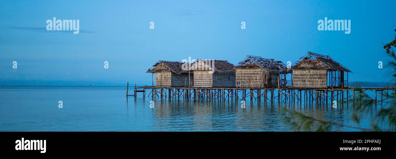 Destroyed water houses at the coastline of Saporkren on Waisai island, Raja Ampat, Indonasia, panorama view Stock Photo