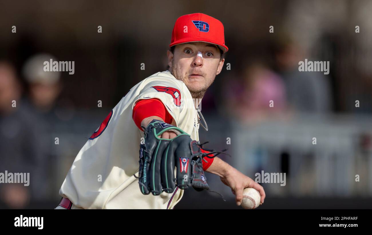 Dayton's pitcher Nate Espelin throws to first base in a pickoff attempt ...