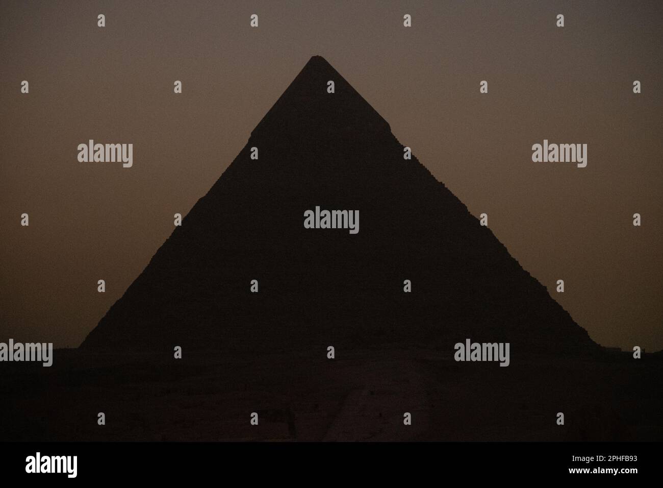 A view of the Pyramid of Khafre after sunset in Giza, Egypt Stock Photo ...