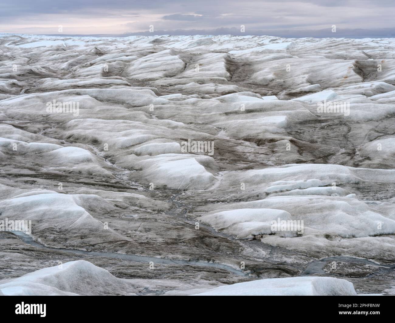 The brown sediment on the Greenland ice is created by the rapid melting ...