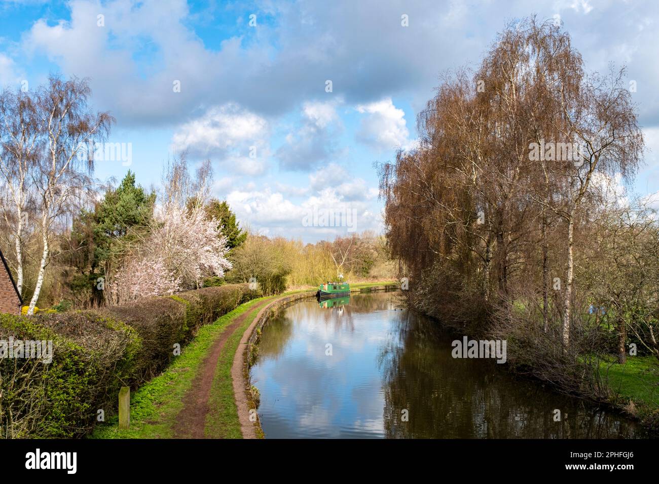 Moored narrow boat on the Trent and Mersey canal in Cheshire UK Stock Photo