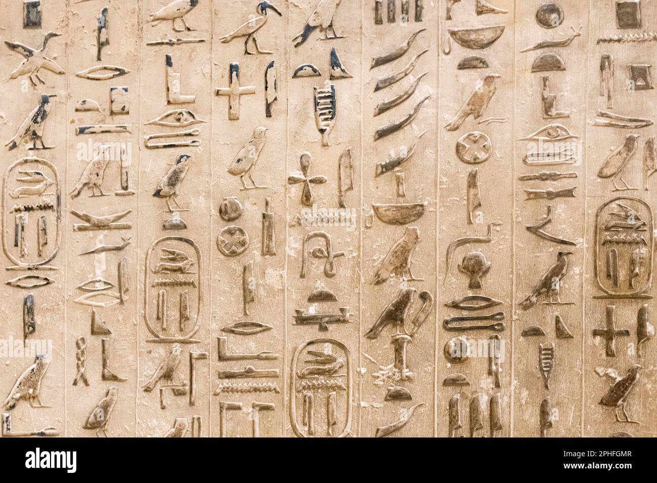 Authentic hieroglyphic inscriptions inside an underground burial chamber by the Pyramid of Djoser at the Saqqara Necropolis in Giza, Egypt Stock Photo