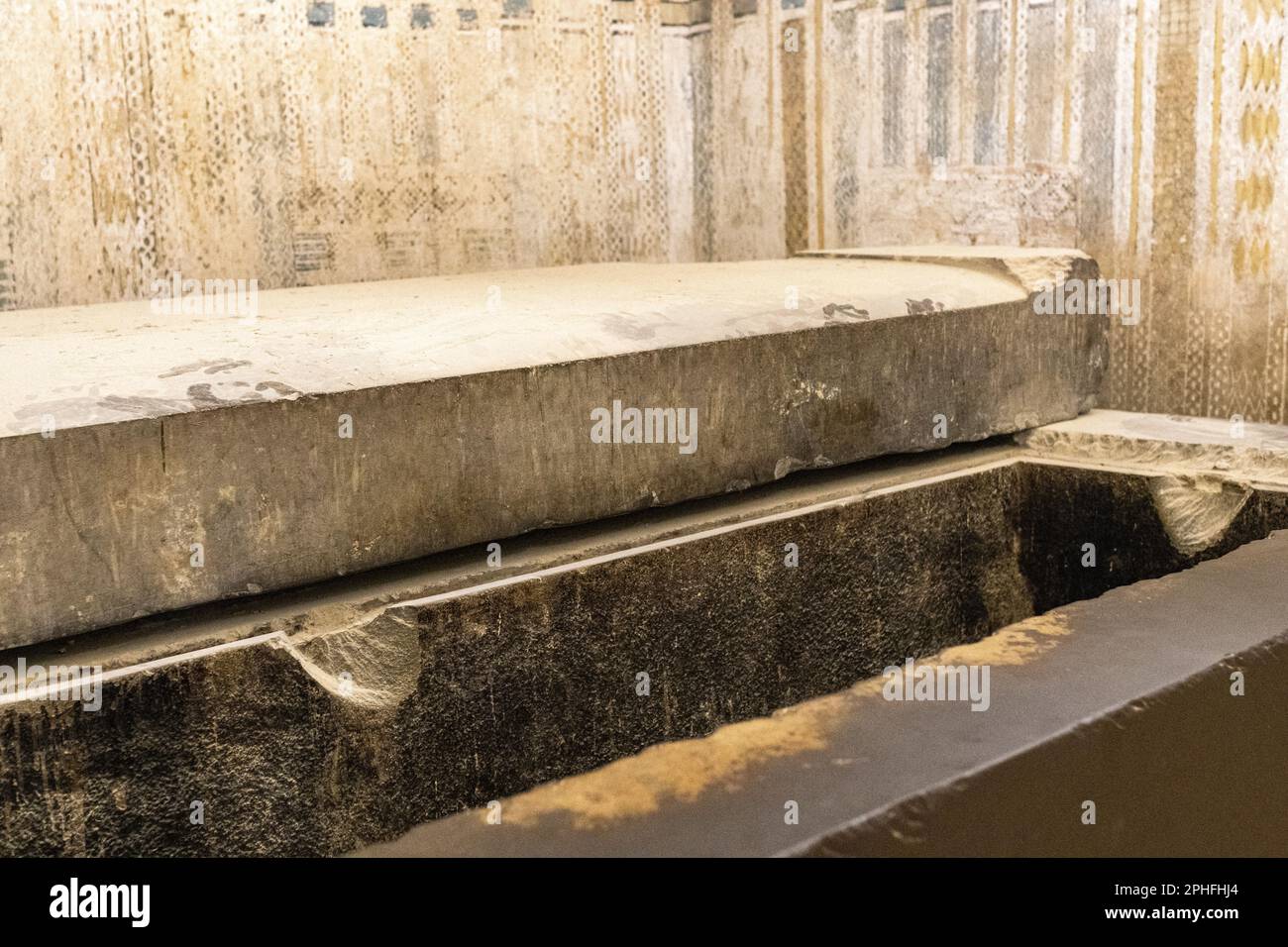 An empty tomb sarcophagus in the underground burial chamber of Unas by the Pyramid of Djoser at the Saqqara Necropolis in Giza, Egypt Stock Photo