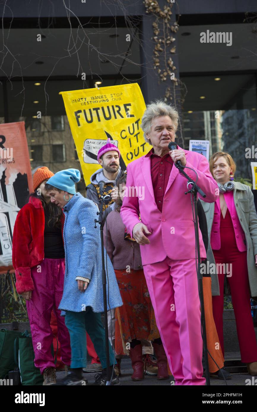 Environmental climate activists demonstrate and march against the big banks continued investment in fossil fuel companies which are slowly devestating the planet in a number of ways. Reverand Billy and the Stop Shopping Choir host the rally be marching on the banks. Stock Photo