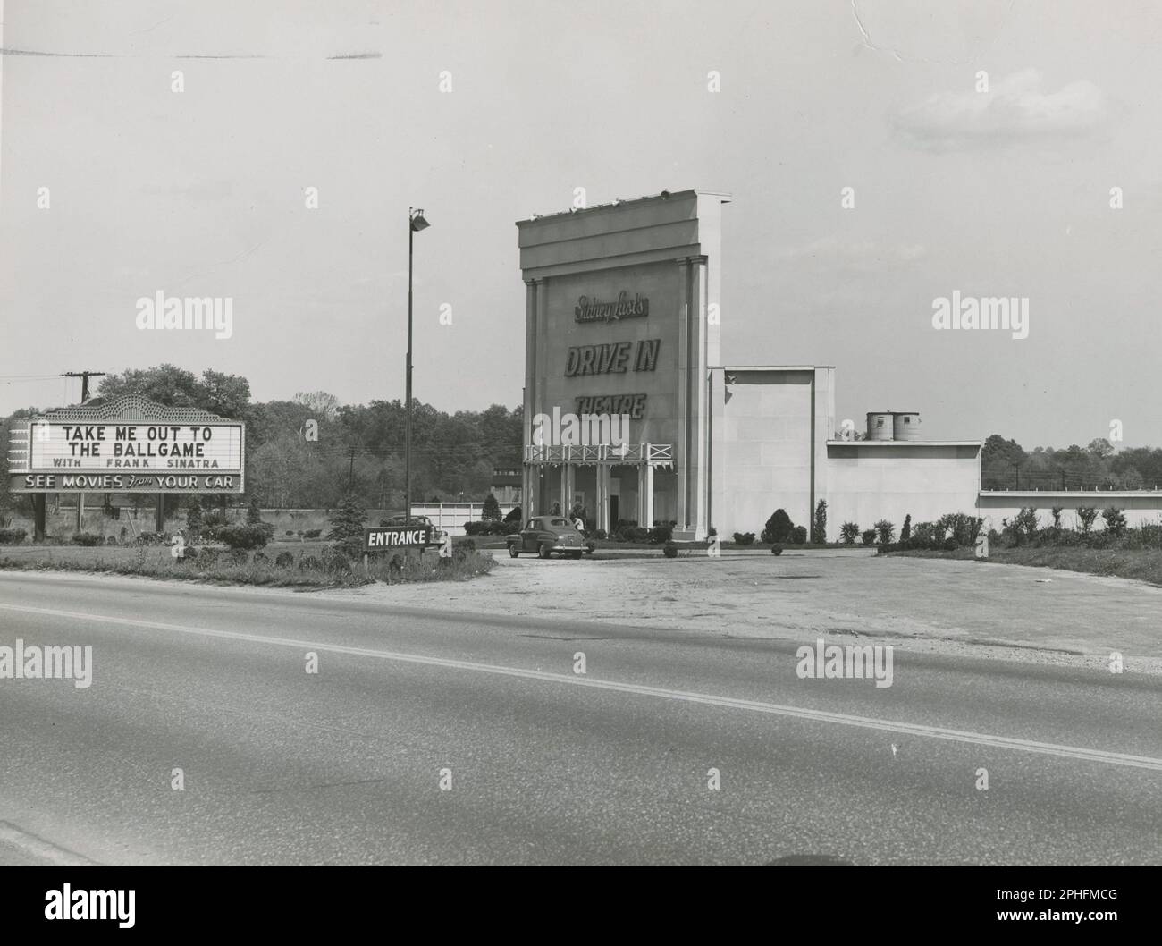 See Movies From Your Car - Entrance and lighted marquee of a drive-in movie theater, Beltsville, MD, circa 1949. (Photo by T W Kines/US Highway Department Stock Photo