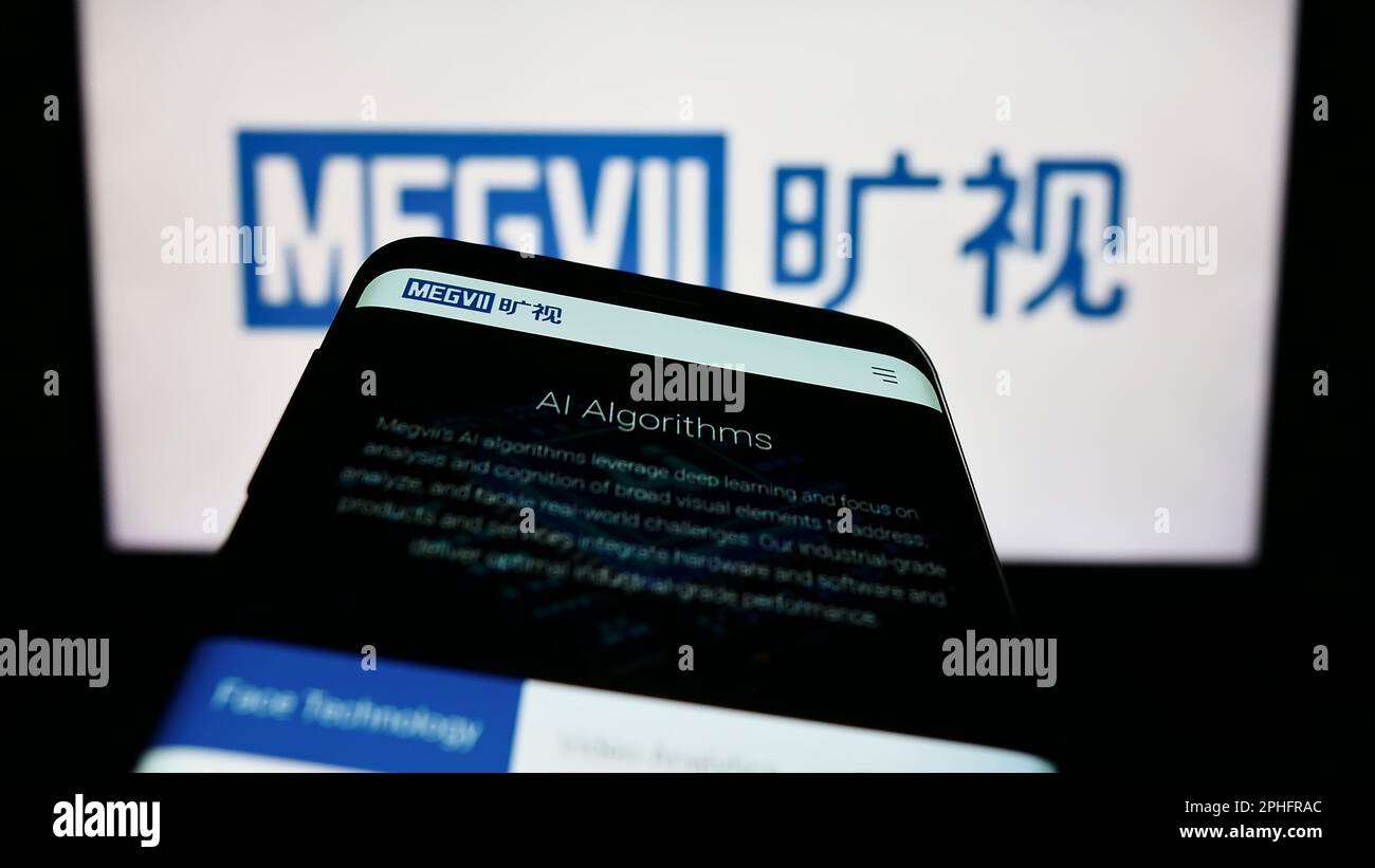 Smartphone with website of Chinese company Megvii Technology Limited on screen in front of business logo. Focus on top-left of phone display. Stock Photo