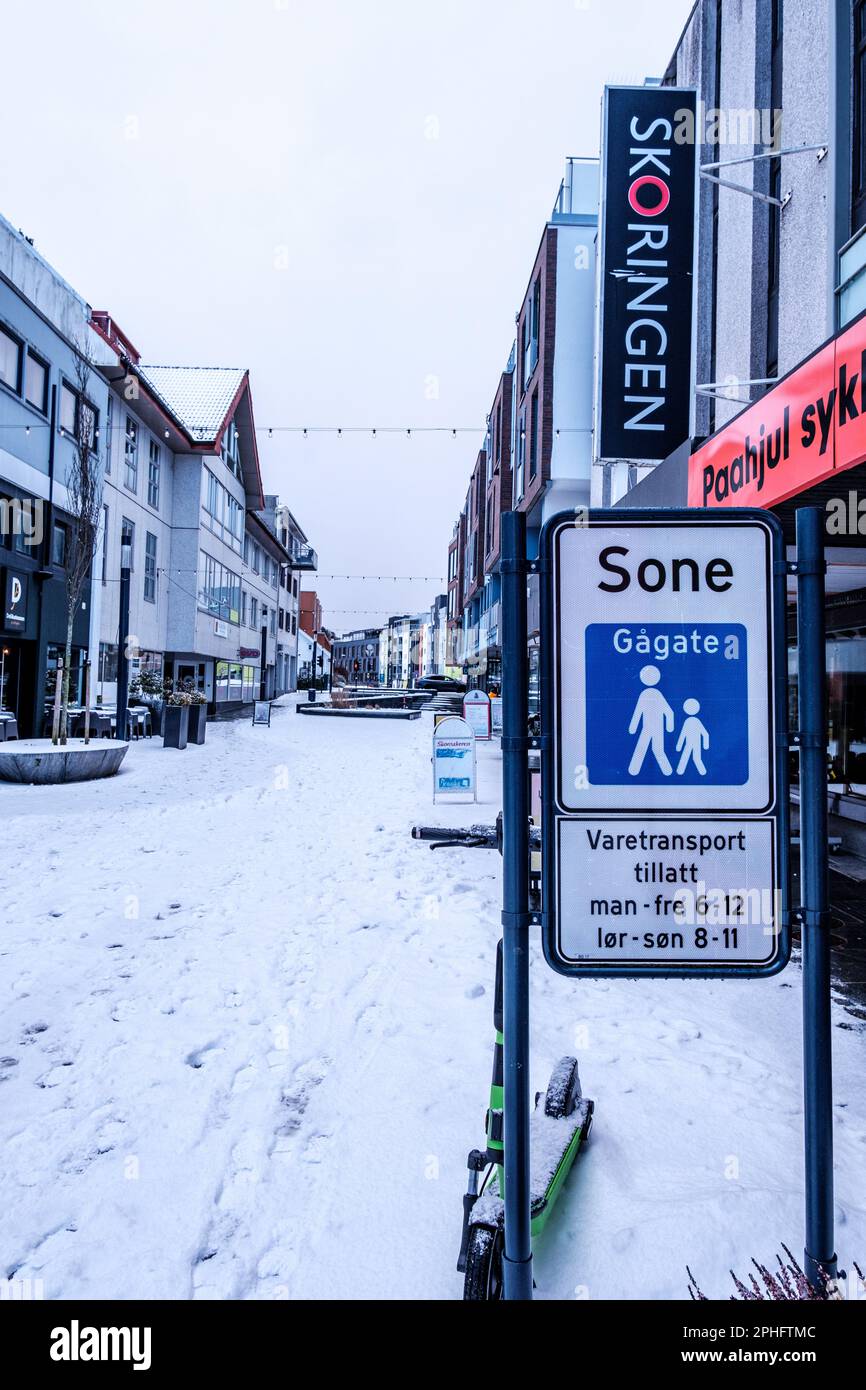 Sandnes, Norway, March 11 2023, Sandnes High Street Pedestrian Zone With Bicycles Retail Sales And Workshop On Snow Covered Morning With No People Stock Photo