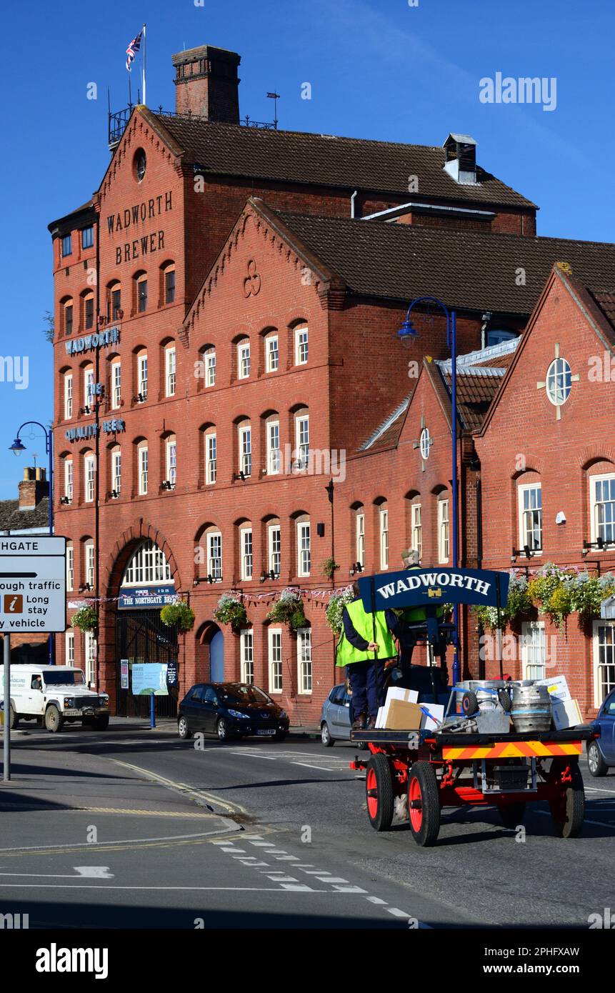 Wadworth shire horse Max delivering beer in Devizes by dray, passing