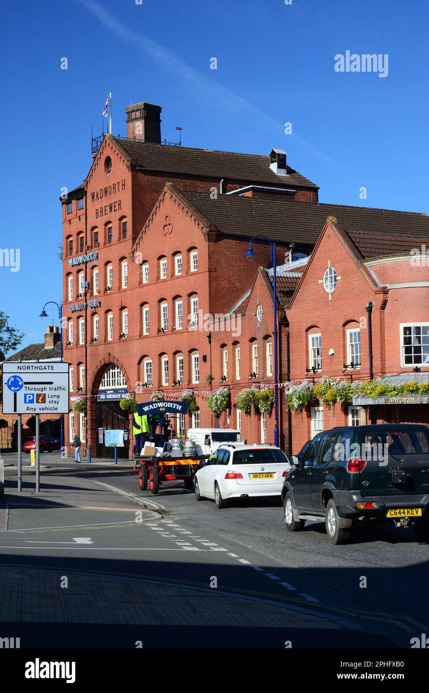Wadworth shire horse Max delivering beer in Devizes by dray, passing