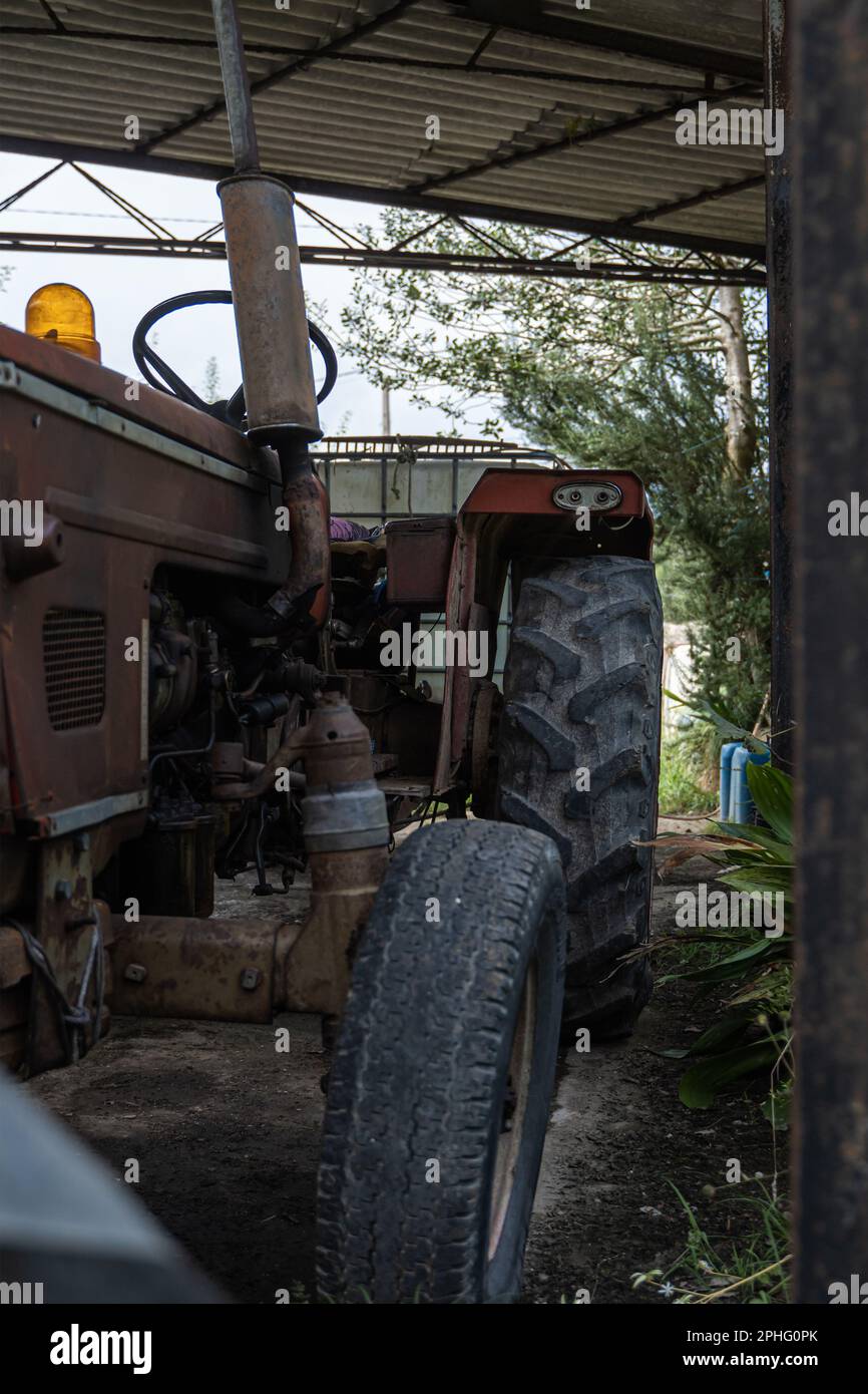 Red tractor parked on green grass hi-res stock photography and images ...