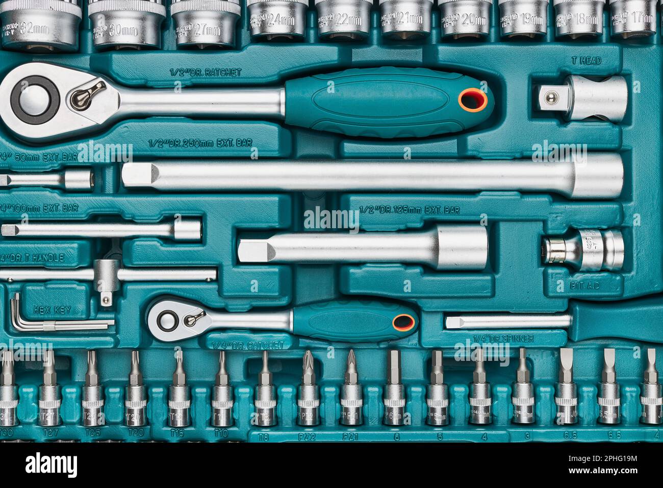 Ratchet with many attachments in plastic case. Work tools. Universal