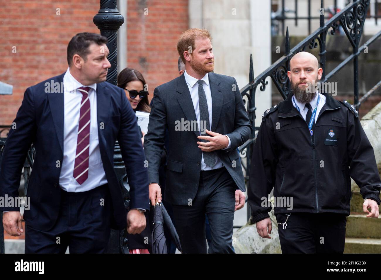 London, UK.  28 March 2023. (C) Prince Harry leaves the High Court on day 2 of a pre-trial hearing.  Seven claimants, Prince Harry, Sir Elton John, David Furnish, Baroness Doreen Lawrence, Sadie Frost Law, Sir Simon Hughes and Elizabeth Hurley, allege serious criminal activity and unlawful information gathering by Associated Newspapers, publisher of the Daily Mail.  Credit: Stephen Chung / Alamy Live News Stock Photo