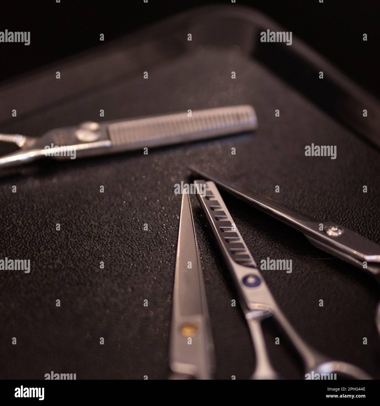 Scissors on barber's work table in hairdresser Stock Photo Alamy