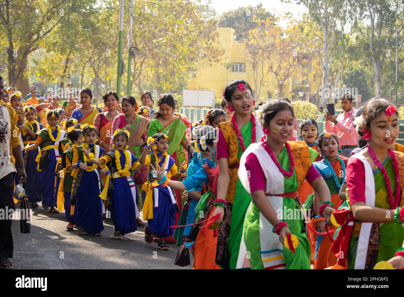 Bolpur, Shantiniketan, West Bengal, India-7th March 2023: number of Indian Bengali girls celebrating holi performing tradition dance Stock Photo