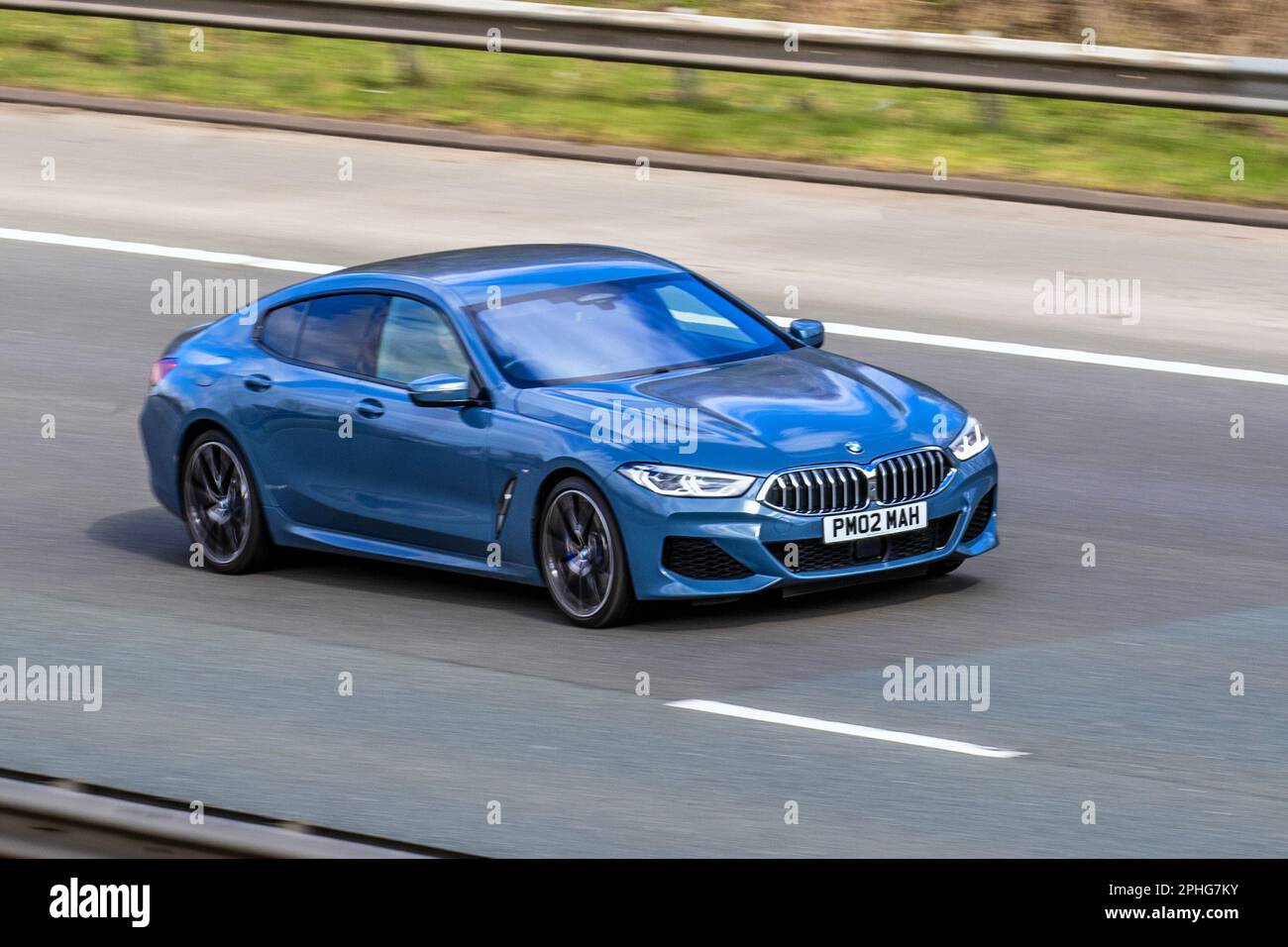2022 Blue BMW 840i M SPORT Auto 740i 2998cc 8 speed automatic; travelling on the M61 motorway, UK Stock Photo