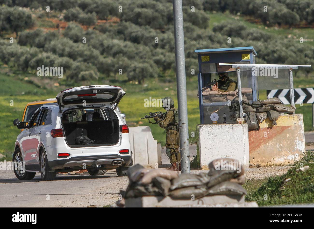 Northern West Bank, Palestine. 27th Mar, 2023. Israeli soldiers search Palestinian vehicles at