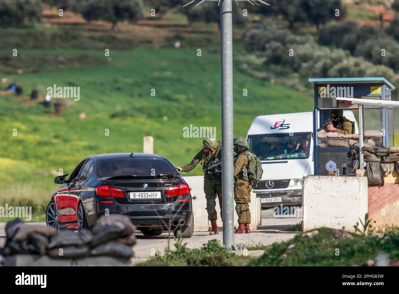 Northern West Bank, Palestine. 27th Mar, 2023. Israeli soldiers search Palestinian vehicles at
