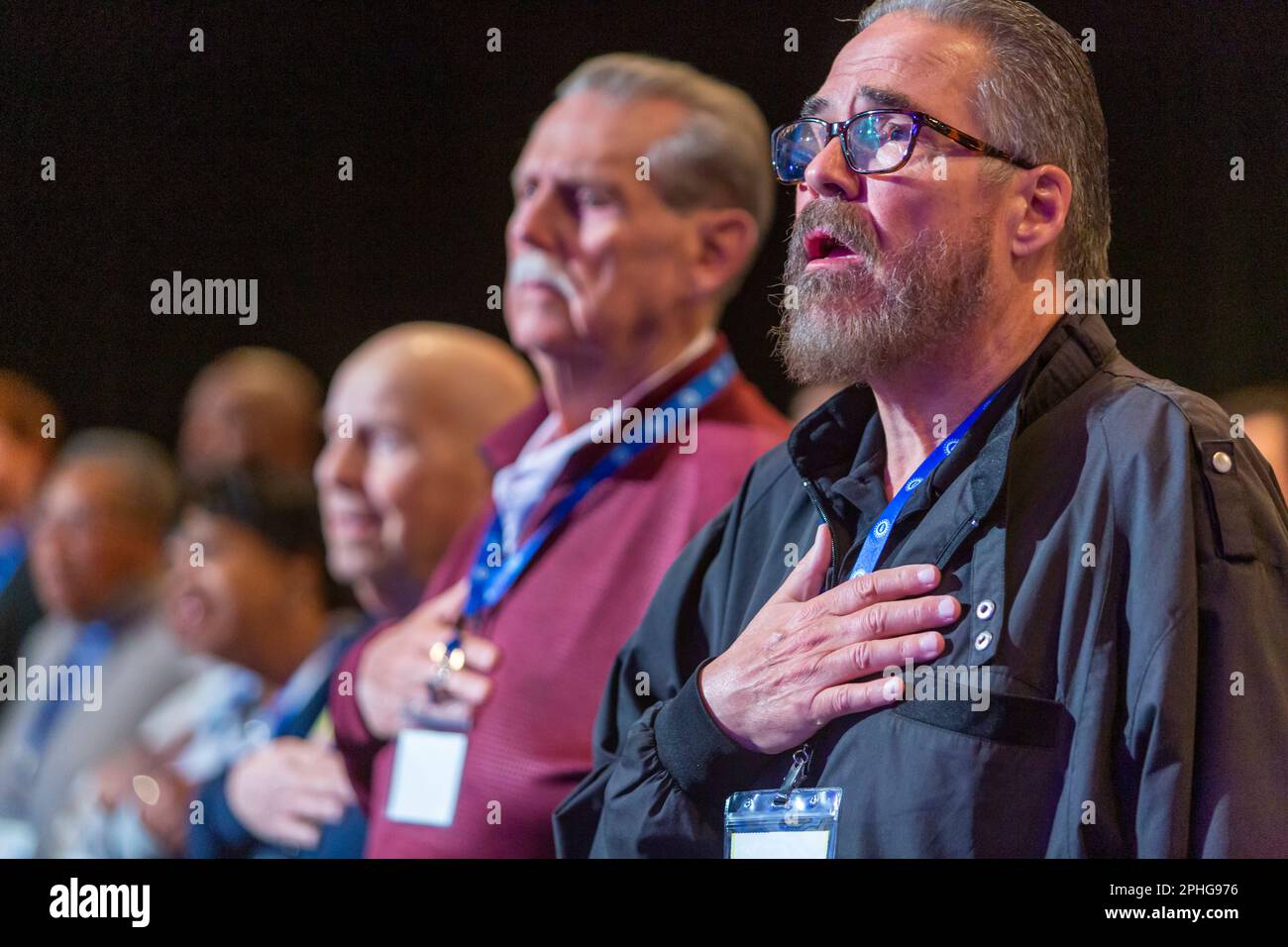 Detroit, Michigan - Delegates recite the Pledge of Allegiance as the United Auto Workers union holds a bargaining convention to set priorities for thi Stock Photo