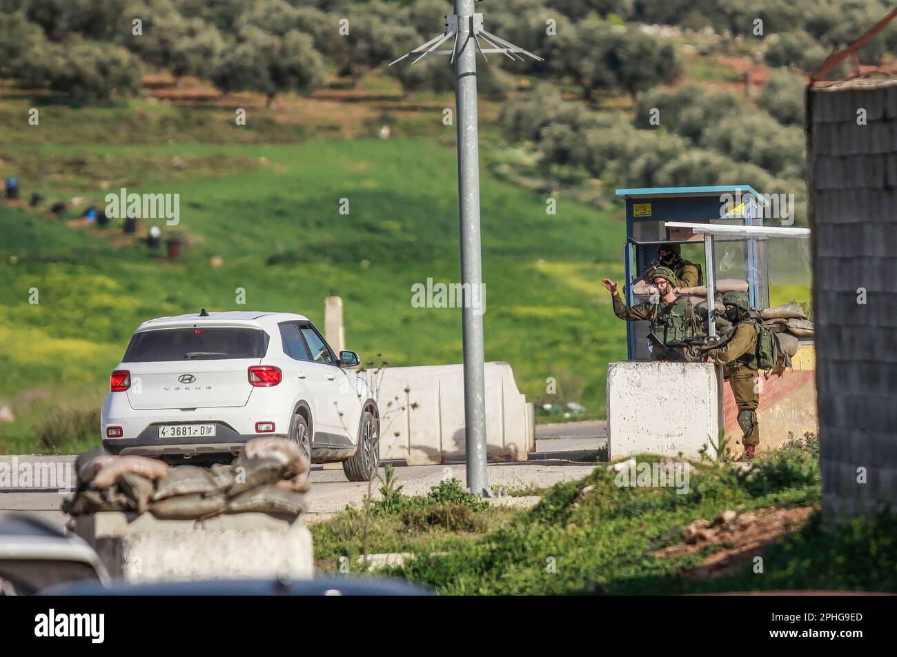 Northern West Bank, Palestine. 27th Mar, 2023. Israeli soldiers checking the identities of