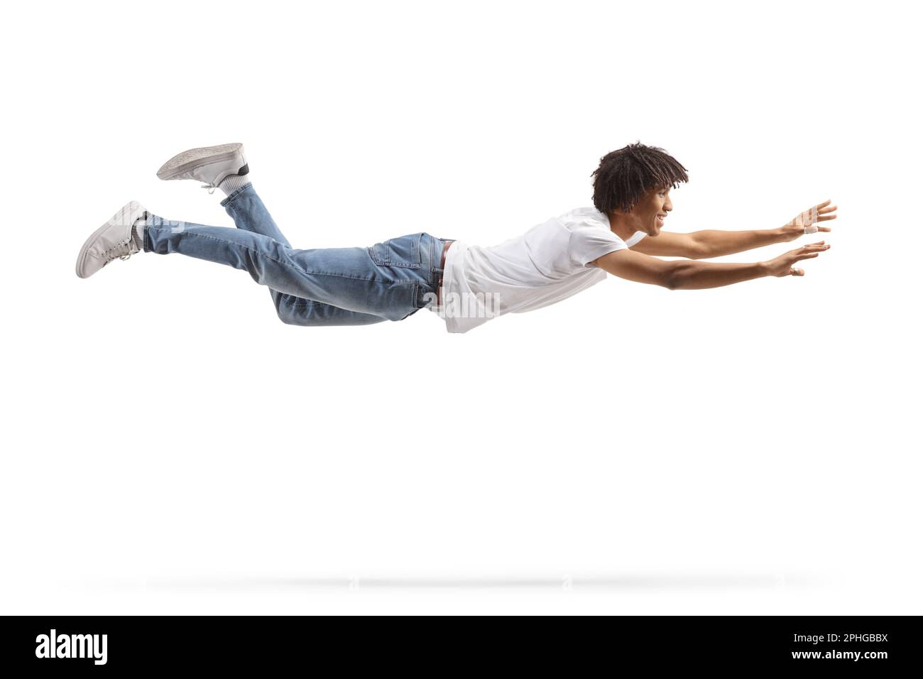 African american guy in jeans and white tshirt flying and trying to