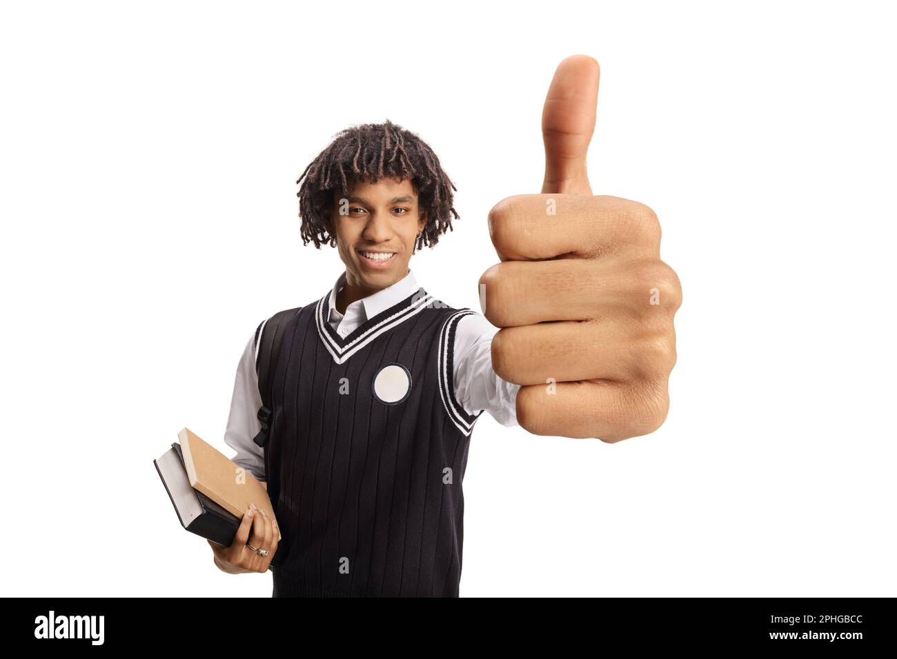 African american male student in a uniform showing thumbs up and ...