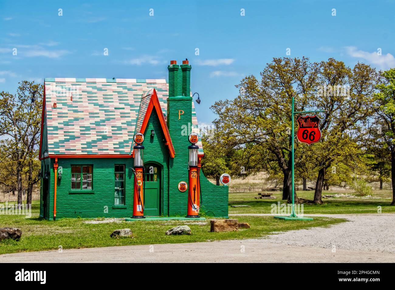 2020 05 14 Oklahoma USA - Vintage Phillips 66 Gas Station with brick painted green and authentic orange  gas pumps and sign Stock Photo